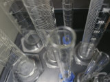 An Array of Graduated Cylinders Sits on a Tray in a Science Class Photographic Print by Roy Gumpel An Array of Graduated Cylinders Sits on a Tray in a Science Class Photographic Print by Roy Gumpel