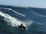 A Surfer and Jet-Skier off the North Shore of Maui Island Photographie par Patrick McFeeley