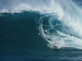 A Surfer Rides a Powerful Wave off the North Shore of Maui Island Photographic Print by Patrick McFeeley