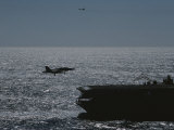 A Jet Comes in for a Landing on an Aircraft Carrier Photographic Print