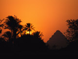 The Step Pyramid of Djoser Silhouetted by the Setting Sun Photographic Print by Kenneth Garrett