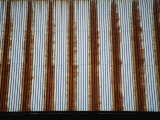 Lines of Rust Make a Bold Pattern Across an Old Corrugated Barn Roof Photographic Print by Stephen St. John