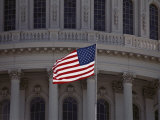 A Backlit American Flag Glows against the Dome of the Capitol Building Photographic Print by Stephen St. John