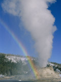 A Rainbow Forms During an Eruption of Castle Geyser Photographic Print by Norbert Rosing