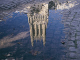 A Puddle Reflects the Central Tower of the Majestic Washington National Cathedral Photographic Print by Stephen St. John
