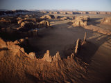 Ancient Sandstone Spires Rise from Monument Valley Photographie par Paul Chesley