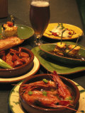 Several Dishes of Tapas and a Beer in a Spanish Restaurant Photographic Print by Richard Nowitz