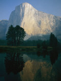 The Sunlit Face of El Capitan is Reflected in the Merced River Photographic Print by Phil Schermeister