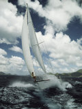 A Woman Aboard a Sailboat on a Rough Sea Photographic Print by Bill Curtsinger