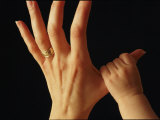 A Babys Tiny Fist Clings to Her Mothers Thumb Fotografie-Druck von Phil Schermeister