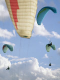 View from Below at Soaring Paragliders against a Cloudy Sky, Near Draper, Utah Photographic Print by Skip Brown