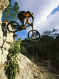 Man Jumping on His Mountain Bike with Ha Ling Peak in the Background Photographic Print by Mark Cosslett