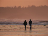 Two People Walk Along the Tidal Flats of Clayoquot Sound Photographic Print by Joel Sartore