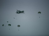 Soldiers Parachute from a Plane During a Training Exercise Photographic Print by Lowell Georgia