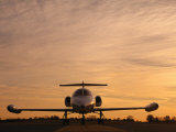 Twilight View of a Lear Jet on the Runway Photographie par Kenneth Garrett