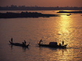 Boats Silhouetted on the Mekong River at Dusk, Phnom Penh, Cambodia Photographic Print by Steve Raymer