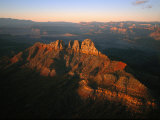 Low Sunlight Shines on Mountains Outside of St. George, Utah; Zion National Park is in the Distance Photographic Print by Melissa Farlow
