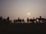 Chincoteague Cowboys Silhouetted against the Morning Sun Photographic Print by Medford Taylor
