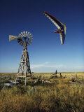 A Hang Glider Swoops Low over an Old Windmill Photographie par Skip Brown