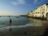 A Beach Goer Wades into the Calm Surf of Cadaques Photographie par Pablo Corral Vega