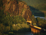 A Train Enters a Tunnel from a Railroad Bridge Over the Potomac River Photographic Print by Joel Sartore