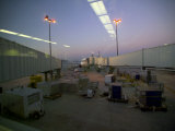 An Airport Ramp and Airplane at Dusk and Reflections on a Windowpane Photographic Print by Raul Touzon