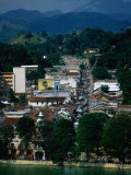 River and City Street in Distance, Kandy, Sri Lanka Photographic Print by Dallas Stribley