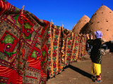 Bedouin Girl Hanging the Laundry Outside Mud-Built Bedouin Girl Hanging the Laundry Outside Mud-Built