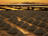 Sun Setting Over Mounds of Salt Drying on Saltpans, Mothia, San Pantaleo, Sicily, Italy Photographic Print by Dallas Stribley