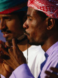 Musician Playing Instrument, United Arab Emirates Photographic Print by Chris Mellor Musician Playing Instrument, United Arab Emirates Photographic Print by Chris Mellor