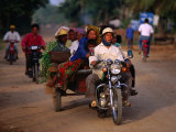 Motorcycle Carrying Produce and People to Bavel, Battambang, Cambodia Photographic Print by Jerry Galea