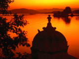 Silhouette of Domed Building on Shore of Lake Pichola at Sunset, Udaipur, Rajasthan, India Photographic Print by Dallas Stribley