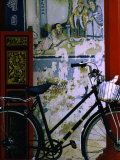 Bicycle Against Muralled Wall of Chinese Temple at Marudi, Sarawak, Malaysia Fotografie-Druck von Mark Daffey