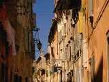 Building Facades in Winding Cobbled Street of Fishing Town, Rovinj, Croatia Photographic Print by Jon Davison
