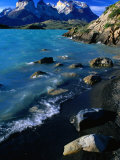 Rocks and Water of Lago Pehoe and the Cuernos Del Paine in Distance, Chile Photographic Print by Brent Winebrenner