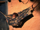 Tharu Child in Hammock Near Karnali River in Western Nepal, Karnali River, Bheri, Nepal Photographic Print by Gareth McCormack