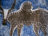 Cow on a Graveyard Headstone near an Oromo village, Ethiopia Photographic Print by Janis Miglavs