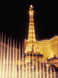 Paris Hotel and Casino's Eiffel Tower with the Bellagio Water Fountain Show, Las Vegas, Nevada, USA Photographic Print by Brent Bergherm