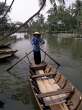 Woman Rowing, Mekong Delta, Vietnam Photographie par Bill Bachmann