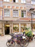 Bicycles Parked in Street, Fussen, Germany Photographic Print by Adam Jones