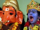 A Child Dressed as Hindu God Krishna Yawns, Chennai, India, September 22, 2006 Photographic Print by M. Lakshman