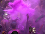 People Painted with Bright Colors Dance During the Festival of Holi on March 7, 2004 Photographic Print by Anupam Nath
