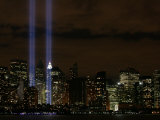 The Towers of Light Shine Over the Manhatten Skyline Photographic Print