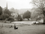 A Woman Walking Her Border Collie Dog in the Countryside Photographie