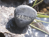 Rock with the Word Friends Beside Water Photographic Print