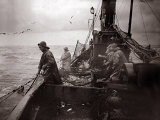 The Crew of a Yarmouth Herring Boat Pull in Their Catch on a Storm Tossed North Sea, 1935 Photographic Print