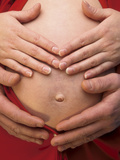 Close-up a Pregnant Woman's Stomach Photographic Print