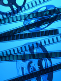 Movie Film and Reel in Blue Light Lámina fotográfica Movie Film and Reel in Blue Light Lámina fotográfica