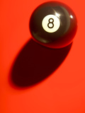 Black and White Eight Ball on with Shadow on Red Background Photographie
