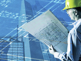 Construction Worker Reviewing a Drafting Plan Photographic Print